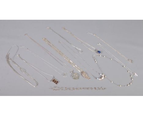 Twelve silver necklets, pendants and necklaces. To include abacus, winged and heart examples. Total weight: 88g  