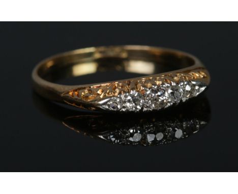 An 18ct Gold and five stone diamond ring. Size PÂ½. Total weight: 2.3g  