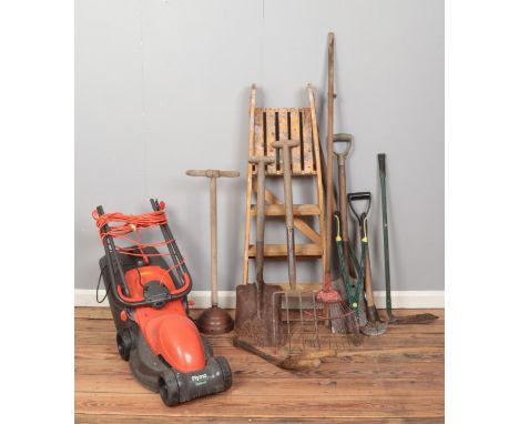 A quantity of assorted garden tools, together with a Flymo Easimo electric lawnmower.  
