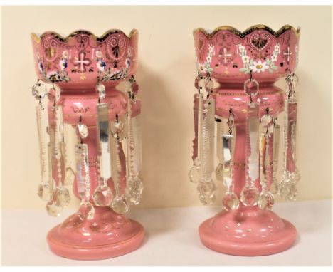 Pair of Victorian opaque pink glass table lustres with polychrome and gilt floral decoration and clear cut glass drops, each 