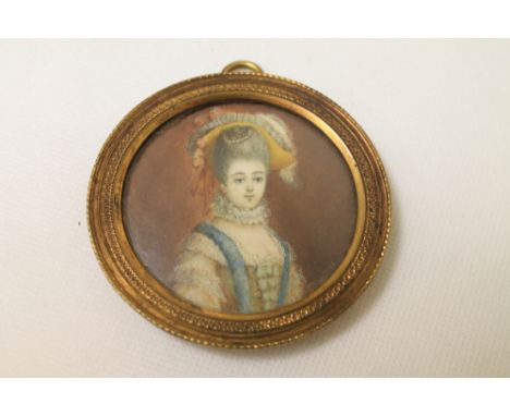 18th century portrait miniature of a Georgian lady, 6.5cm diam. (circular) in gilt metal frame.