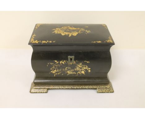 19th century black lacquered papier mâché tea caddy of bombe form with gilt floral decoration, the interior with two lidded c
