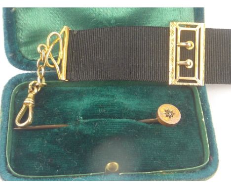 Watch ribbon with gold fittings '9ct' and a scarf pin with tiny diamond.