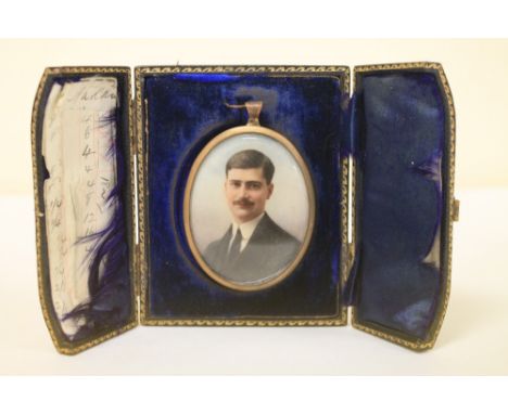 Edwardian portrait miniature of a young man, 6.5 x 5cm (oval), contained in blue leather case with easel back.
