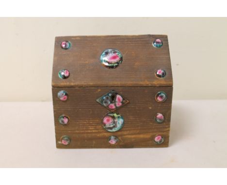 Arts & crafts small pine box of rectangular form with pitched lid, inset with green, pink and blue enamel roundels and escutc