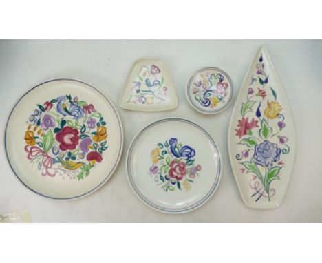 A collection of floral decorated Poole Pottery items to include spear platter, serving platter, decorative wall plates (dia o
