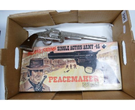 Two blank firing Wild West replica pistols - one boxed single action Army .45 Peacemaker 1973 model and an unboxed highly dec