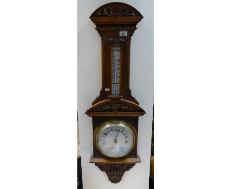 A heavily carved Edwardian Aneroid Barometer (unnamed).