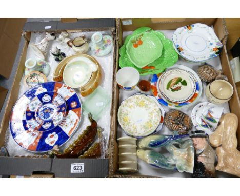 A mixed collection of ceramic items to include Royal Doulton Winston Churchill Toby Jug, Sylvac novelty dog, ceramic Budgerig