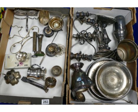 A collection of silver plated items including - candelabras, serving platters, spoon sets etc. (2 trays).