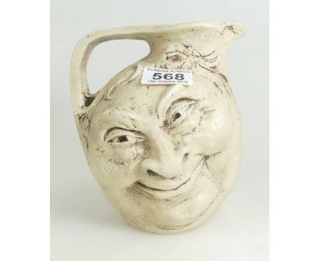 Vintage double sided Grotesque face jug in the style of Martin Brothers