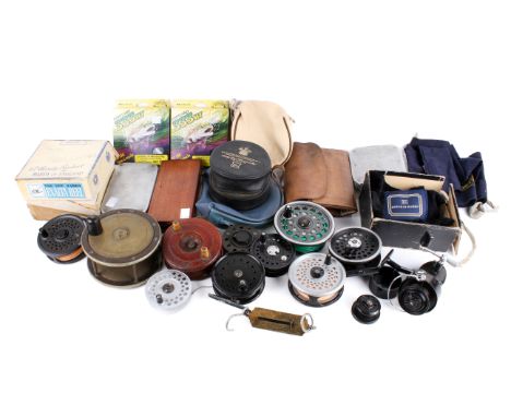 A box of mixed vintage fishing tackle. Including reels, line, a fly wallet and Wheatley fly/cast tins