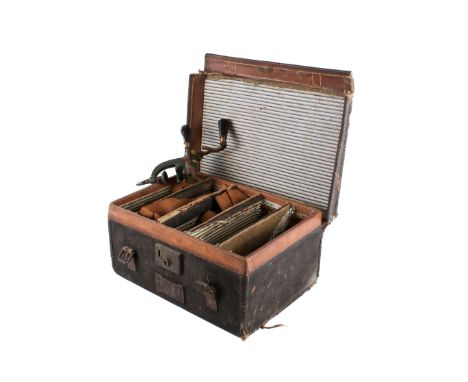 A vintage gun cartridge case and accessories. Including a  clamp by Hawklsley, no. 12, a turned boxwood and brass filler and 