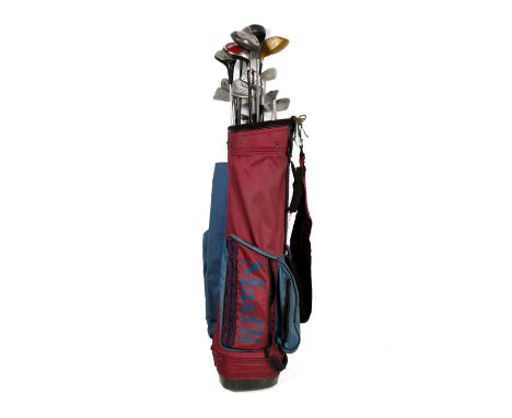 A collection of golf clubs in a red and blue bag. Good range of clubs including a Task Force Driver, Dunlop irons and Mitsubi