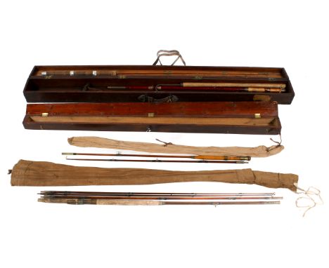 Two vintage wooden rod carrying cases containing four rods. One case with original North British Railway and Southern Rail st