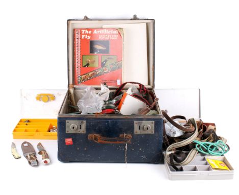 A quantity of fishing equipment and accessories in a vintage case. Including hooks, books, line, etc. 