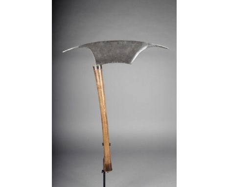An Igorot axe, Philippines, with distinctive steel blade and a wood handle with stained ends, 50.5cm long.