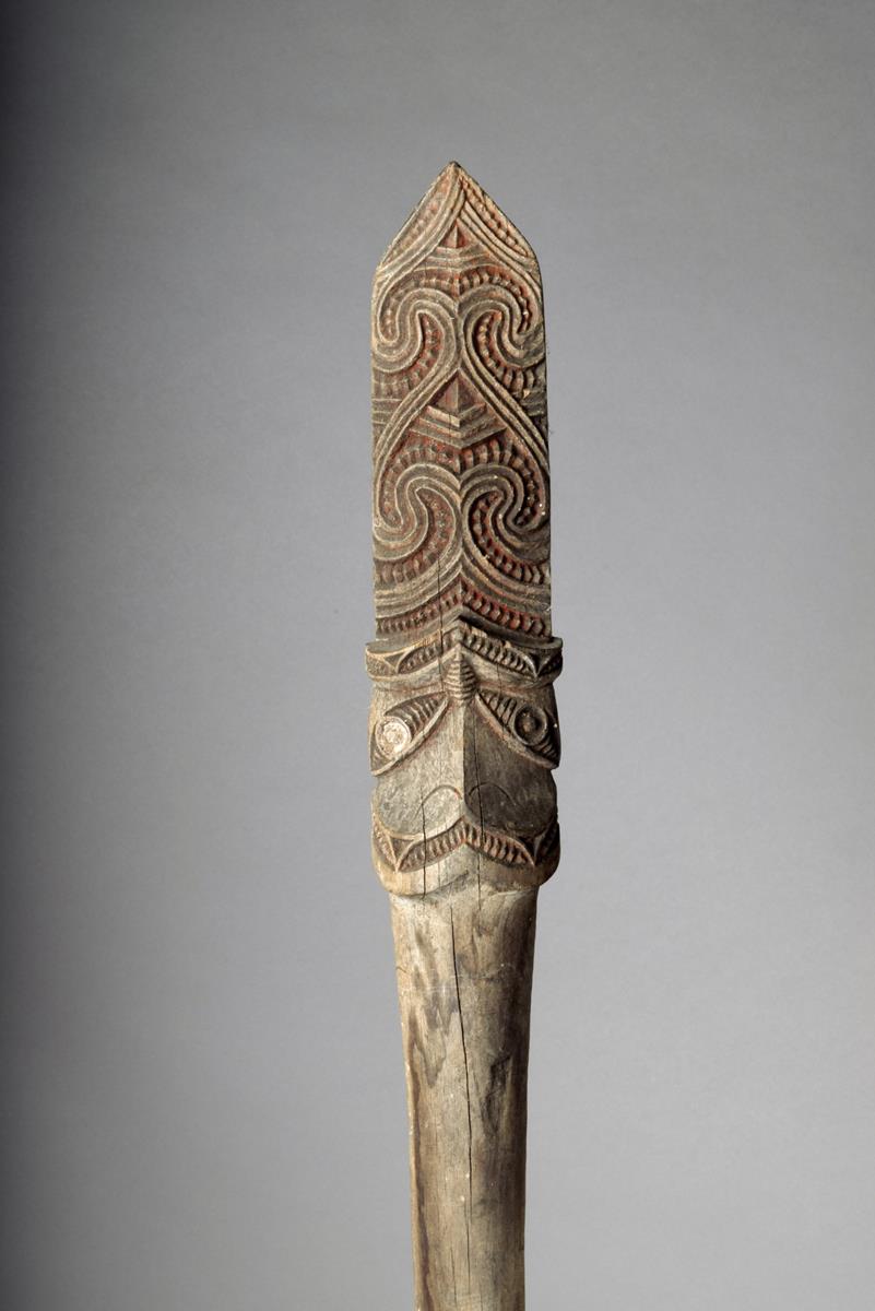 A Maori taiaha, quarter-staff, with Janus head terminal and scrolls and ...