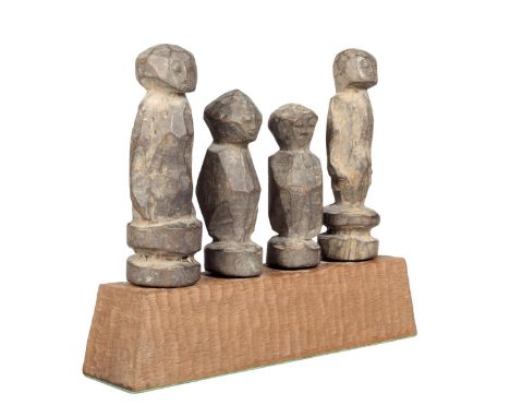 Four Lobi half-figures, Burkina Faso, with arched eyes and reel bases, 14cm highest, mounted together. (4) Provenance: Ian Au