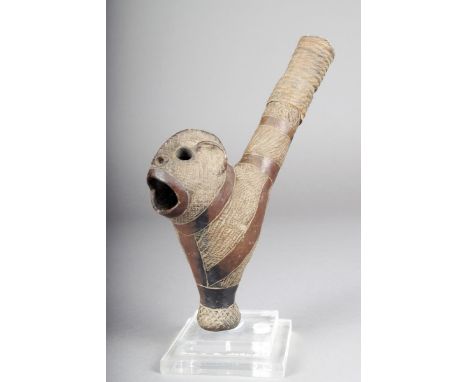 A Shilluk pottery pipe, Sudan, with a leopard head bowl, textured decoration and a fibre bound sleeve, 23cm high. Provenance: