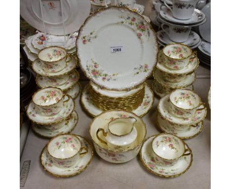 A Victorian floral transfer printed tea set for twelve, including cups, saucers, cake plates, etc.