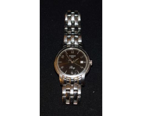 Tissot - a ring wristwatch, black dial, raised alternate Arabic numerals and block baton markers, minute track, centre second