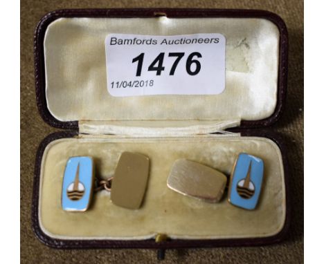 A pair of Art Deco gilt and enamel cufflinks, cased