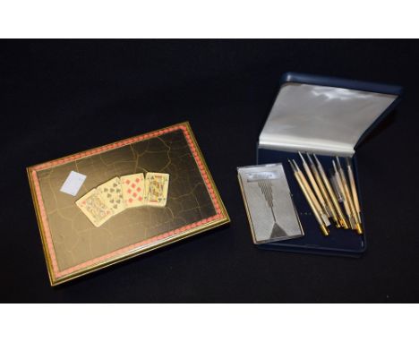 A set of four sterling silver Bridge pencils; a further set; a Bridge score note pad; a playing card box