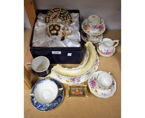 A Royal Crown Derby 2451 pattern cup and saucer; a miniature garden bench; Derby Posies cream jug, sugar bowl, cups and sauce