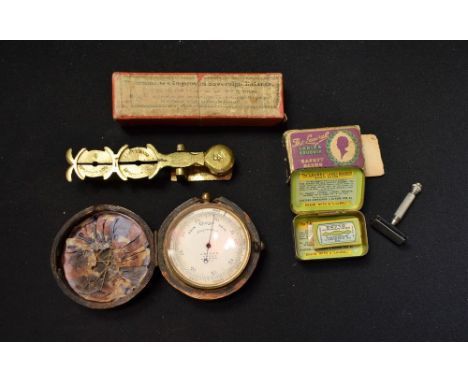 An early 19th century pocket barometer; a brass sovereign balance, boxed; a boudoir safety razor, boxed (3)
