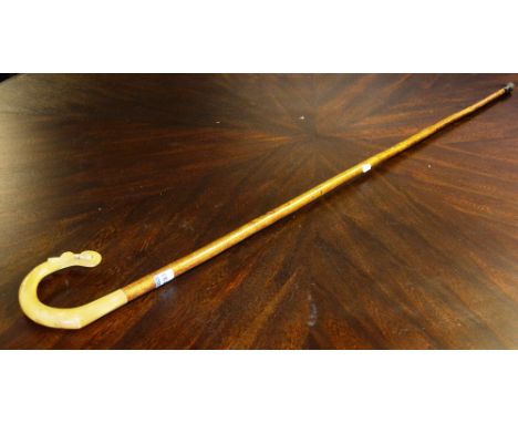 A Shepherds walking stick, with amber coloured crook decorated with thistle, 131cm long