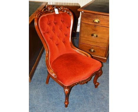 A Victorian style reproduction parlour chair, upholstered in rust coloured button back velour, 91cm high x 61cm wide