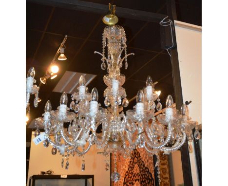 A good cut glass ceiling light, the top section with cut glass bowls above candy cane branches, decorated with pear shaped cu