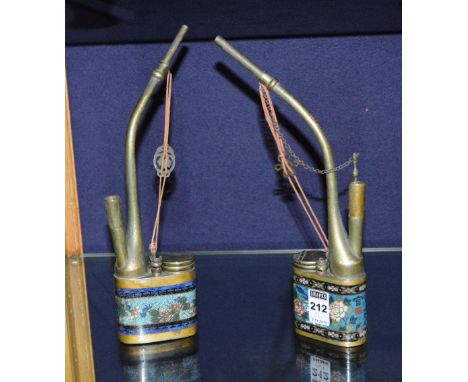 Two cloisonne opium pipes, decorated with foliate panels on blue ground, 27cm high CONDITION REPORT: Lot 212 - Metal work dis