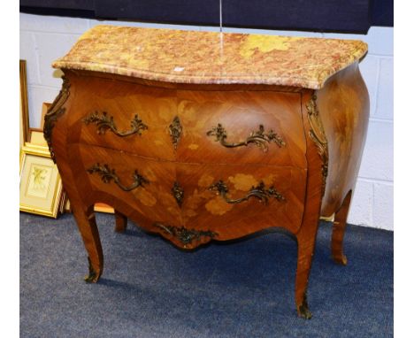 A Louis XVI style commode chest of drawers, with serpentine shaped mottled marble top, above two drawer bombe base, decorated