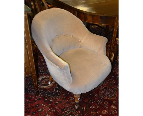 A Victorian armchair, upholstered in button back cream velour, raised on turned mahogany supports, 79cm high x 73cm wide