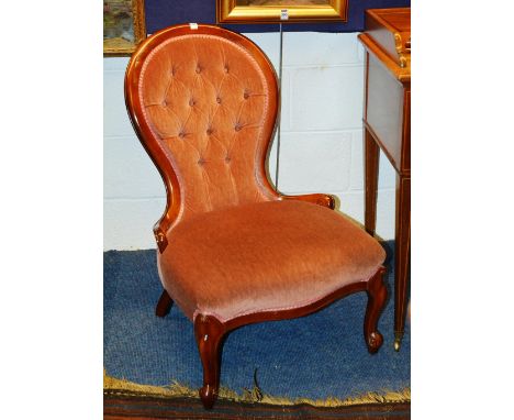 A lady's button back chair, the moulded frame with sprung seat, raised on cabriole legs, 56cm wide x 84cm high x 72cm deep