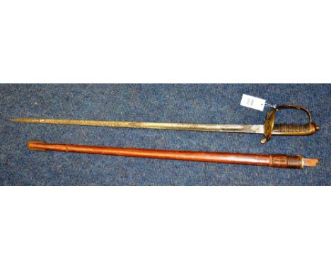 A George V officers sword, with metal flat pommel and hilt bearing commemorative crown, shagreen grip, the blade engraved to 