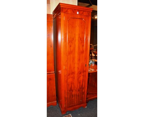 A modern yewwood tall boy/cupboard, hand crafted by Le-Al, the dentil top above panelled door, enclosing fitted shelf, 194cm 