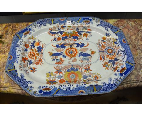 A large Victorian Spode pottery ashet, decorated with red and blue enamel floral panels on white ground, 53.5cm diameter