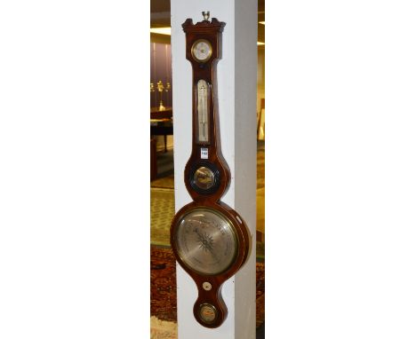 An early 19th century mahogany wheel barometer, with silvered thermometer, temperature and gauges, 96cm long CONDITION REPORT