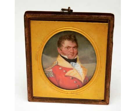 A portrait miniature of a military officer, watercolour on ivory, circa 1820, in gilded leather oval frame CONDITION REPORT: 