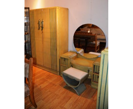 An Art Deco limed oak bedroom suite, comprising of ladies and gents wardrobes, dressing table and stool, ladies wardrobe 185c