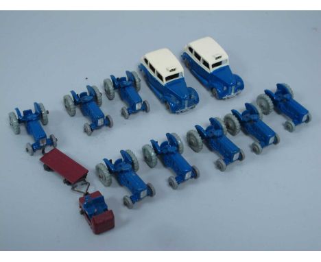 Eleven Orginal Dinky Toys 'Dublo' Diecast Model Vehicles comprising of Eight Tractors, Two Austin Taxis, Station Tractor and 