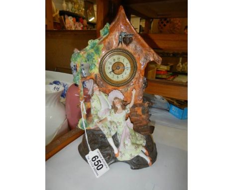 An early 20th century bisque porcelain clock in working order.