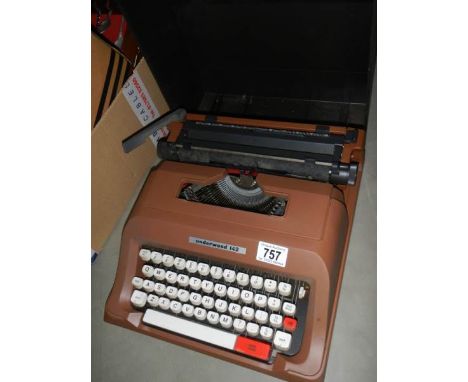 A portable typewriter.