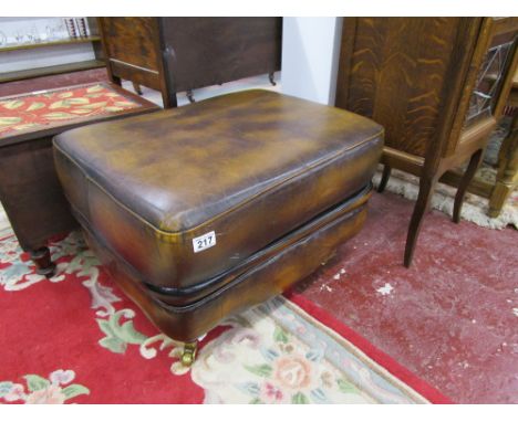Leather pouffe on legs