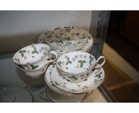 A Wedgwood 'Wild Strawberry' pattern part Tea service including three cups and saucers, four bowls and three plates
