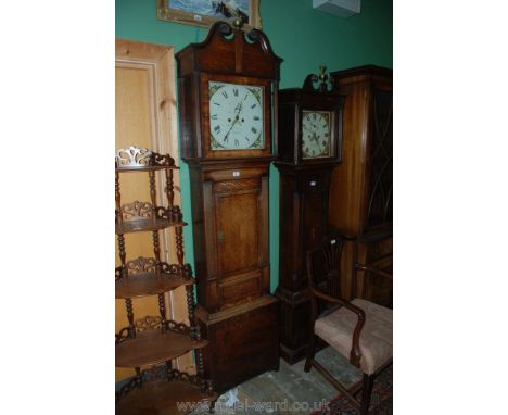 An Oak cased Longcase Clock having ebony stringing, reeded details to each side of the case and hood and having an eight day 
