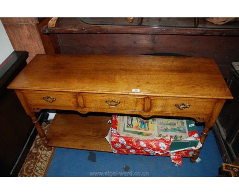 A compact, nice quality, reproduction pot board Welsh Dresser Base in medium Oak having three frieze drawers with brass back 